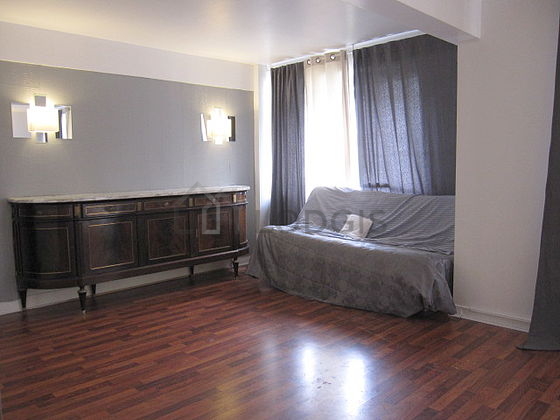 Living room with windows and balcony facing the garden