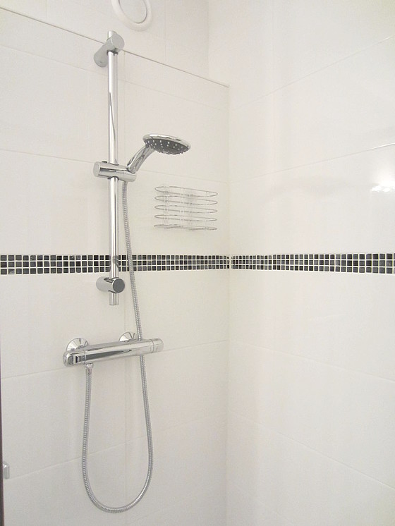 Bathroom equipped with washing machine, bath towels