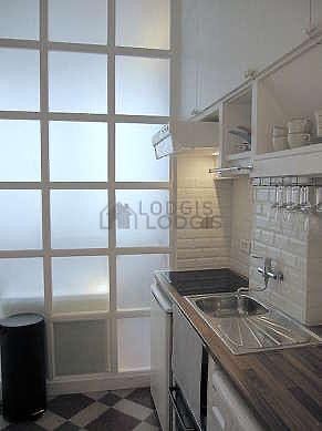 Kitchen equipped with washing machine, refrigerator, freezer, extractor hood