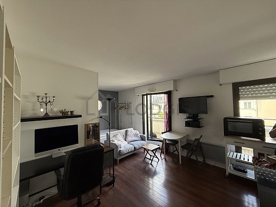 Very quiet living room furnished with 1 bed(s) of 140cm, tv, dvd player, storage space