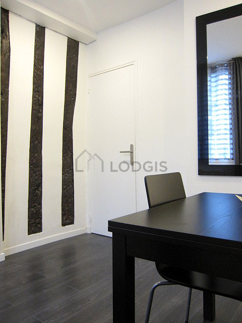 Dining room with windows facing the road