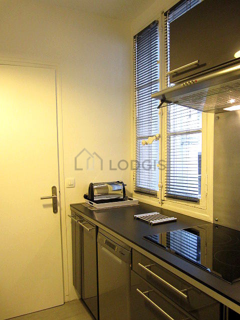 Bright kitchen with windows facing the courtyard