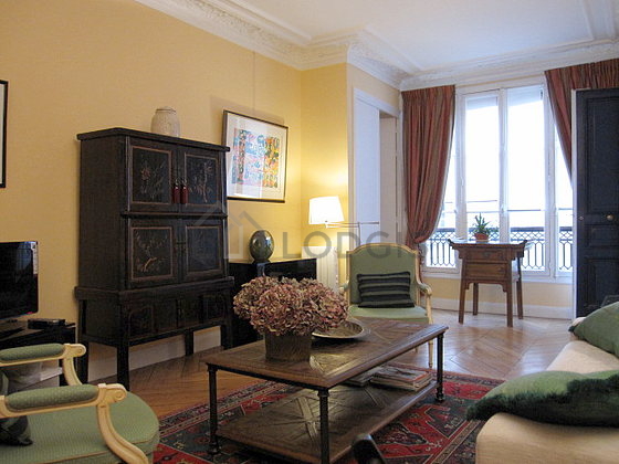 Living room with windows facing the courtyard