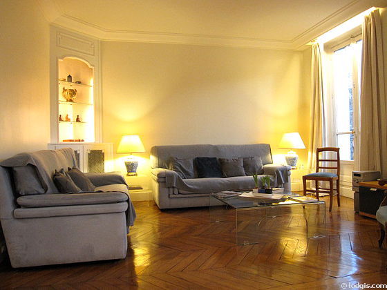 Quiet living room furnished with tv, hi-fi stereo, 1 armchair(s), 8 chair(s)