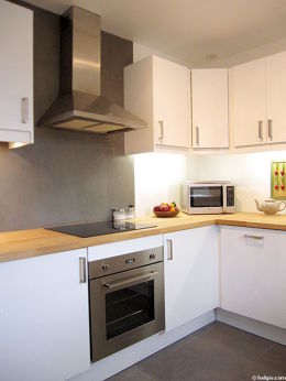 Kitchen where you can have dinner for 2 person(s) equipped with washing machine, dryer, refrigerator, extractor hood