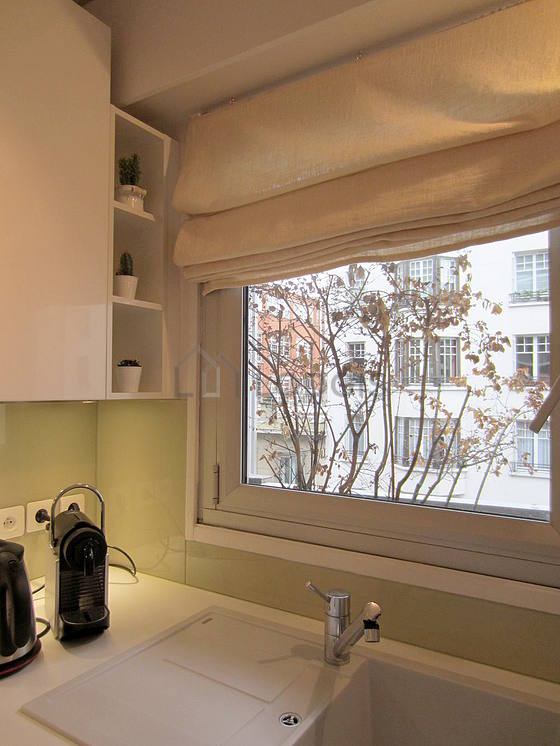Bright kitchen with double-glazed windows facing the road