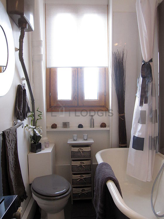 Beautiful and bright bathroom with double-glazed windows and with concrete floor