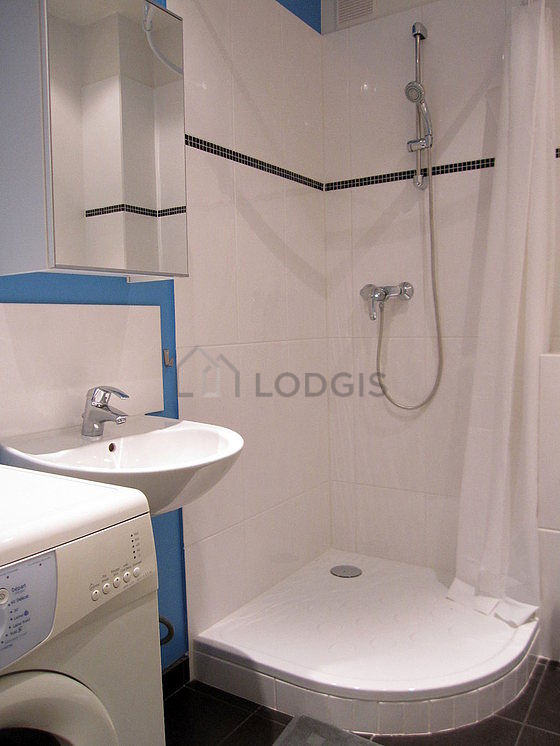 Bathroom equipped with washing machine, bath towels