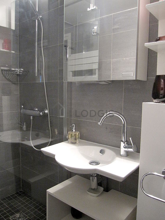 Bathroom equipped with washing machine, bath towels