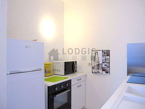 Kitchen where you can have dinner for 2 person(s) equipped with hob, refrigerator, crockery