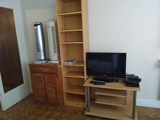 Quiet living room furnished with 1 sofabed(s) of 120cm, tv, wardrobe, cupboard