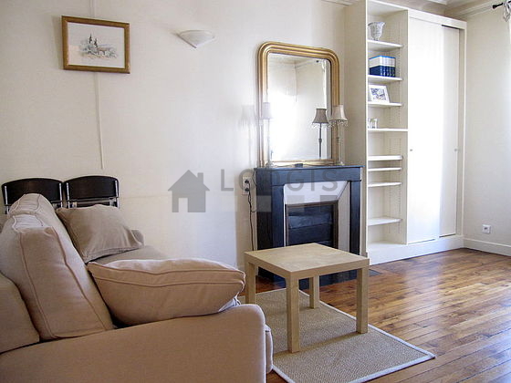 Quiet living room furnished with 1 sofabed(s) of 140cm, tv, wardrobe, cupboard