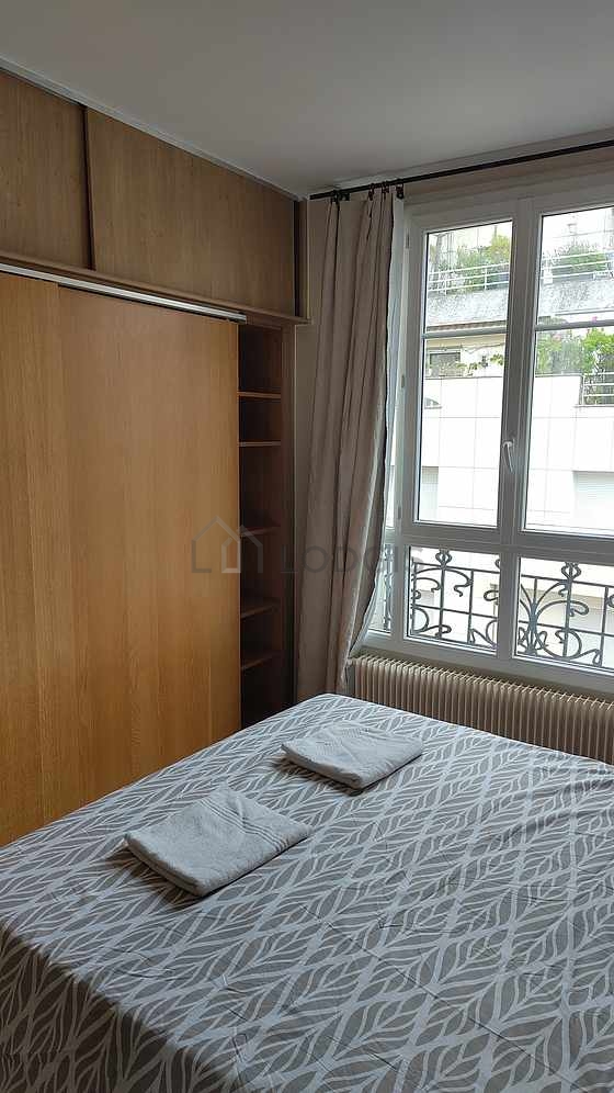 Bedroom with double-glazed windows facing the road