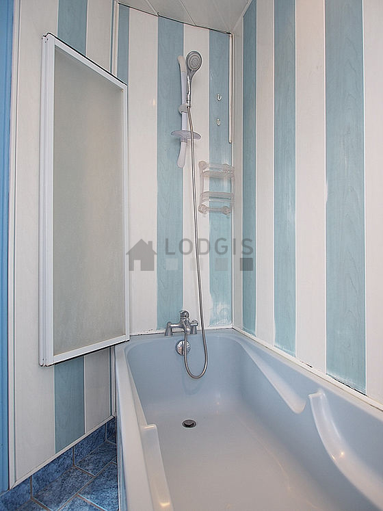 Bright bathroom with double-glazed windows and with tile floor