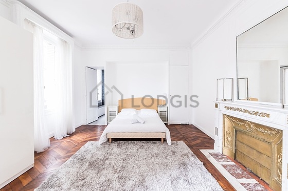 Bedroom with wooden floor