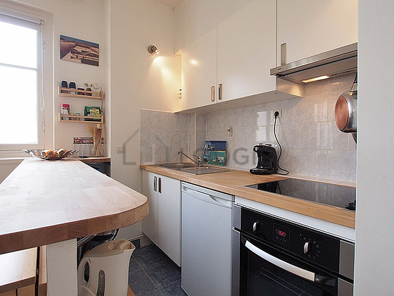 Kitchen equipped with dishwasher, hob, refrigerator, freezer