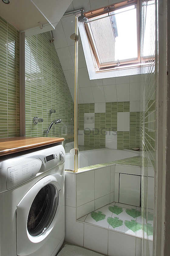 Bathroom equipped with washing machine, bath towels