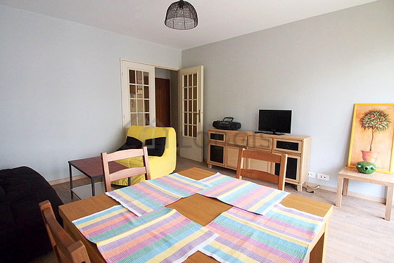Living room with double-glazed windows and balcony facing the courtyard
