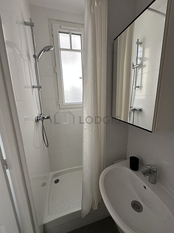 Beautiful and bright bathroom with windows and with tile floor