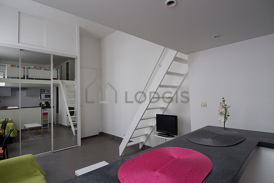 Living room with double-glazed windows facing the road