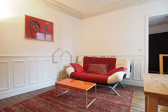 Quiet living room furnished with 1 sofabed(s) of 140cm, dining table, coffee table, cupboard