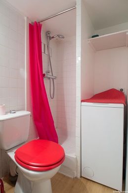 Bathroom equipped with washing machine, bath towels