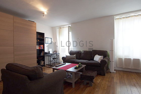 Living room with double-glazed windows facing the road