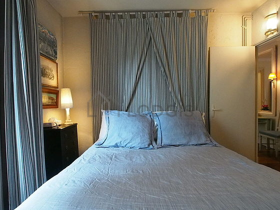 Bright bedroom equipped with wardrobe