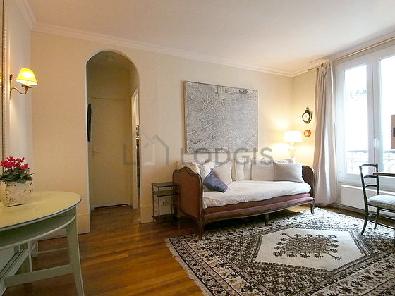 Quiet living room furnished with tv, dvd player, storage space, 3 chair(s)