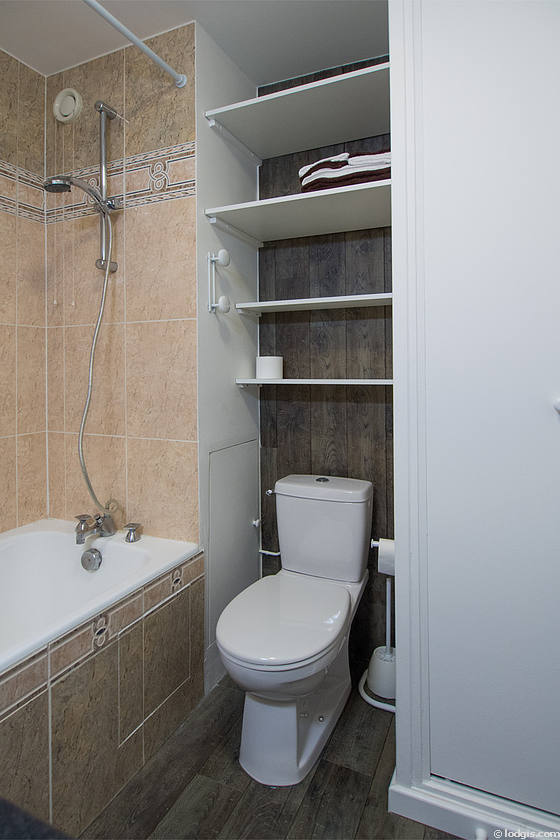 Bathroom equipped with washing machine, bath towels