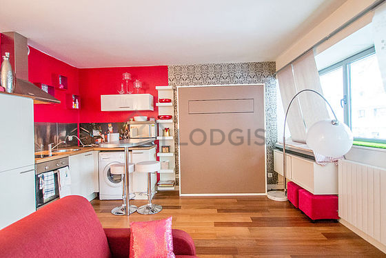 Living room with double-glazed windows facing the road