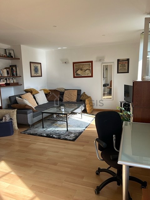 Living room with double-glazed windows facing the road