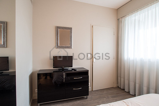 Bedroom with double-glazed windows facing the road