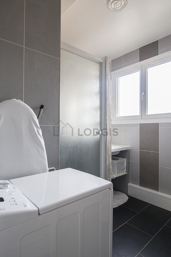 Beautiful bathroom with double-glazed windows and with tile floor