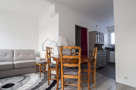 Living room with double-glazed windows and balcony facing the road