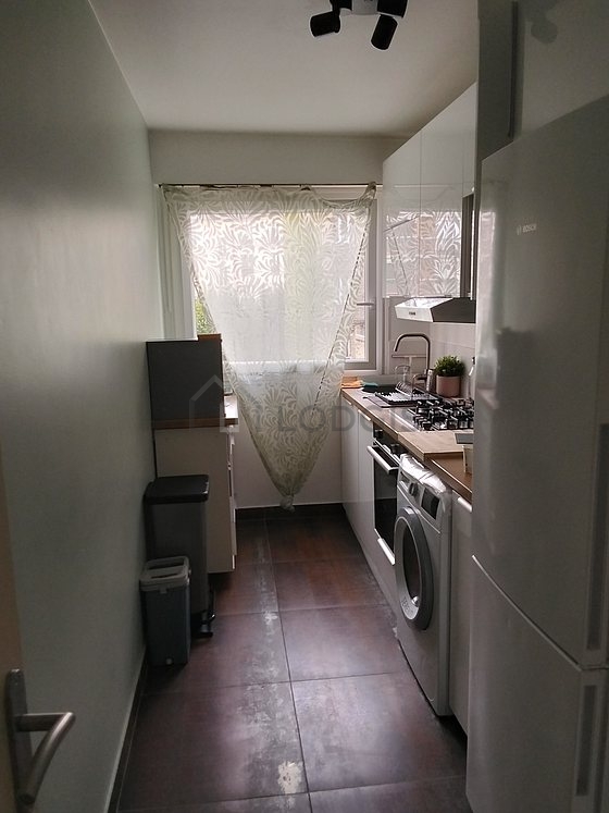 Bright kitchen with windows facing the courtyard