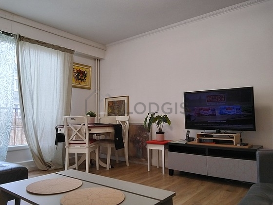 Very quiet living room furnished with tv, wardrobe, cupboard, 3 chair(s)