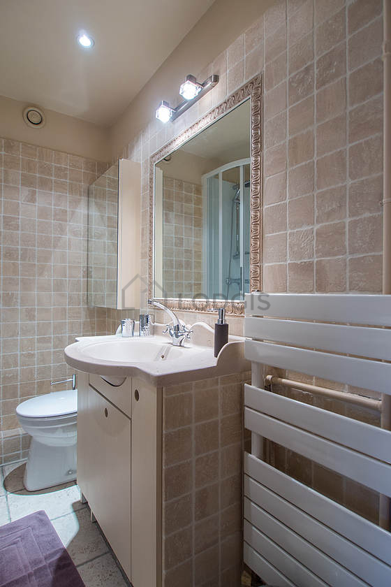 Bathroom equipped with washing machine, bath towels
