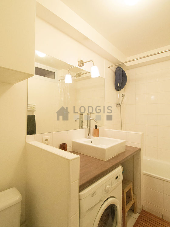 Bathroom equipped with washing machine, bath towels