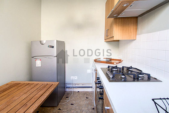Kitchen where you can have dinner for 2 person(s) equipped with washing machine, refrigerator, extractor hood, crockery