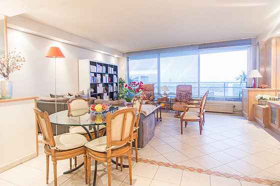 Living room with windows and balcony facing the courtyard