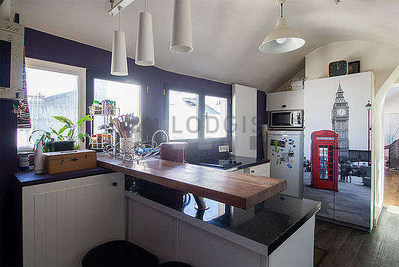 Bright kitchen with double-glazed windows facing the road