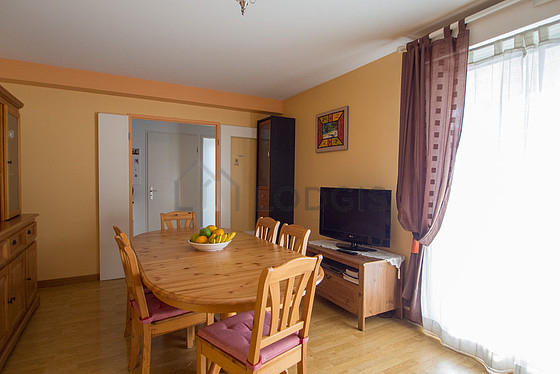 Living room with double-glazed windows and balcony facing the courtyard