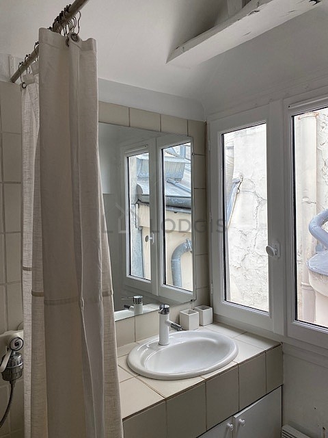 Bathroom equipped with washing machine, bath towels