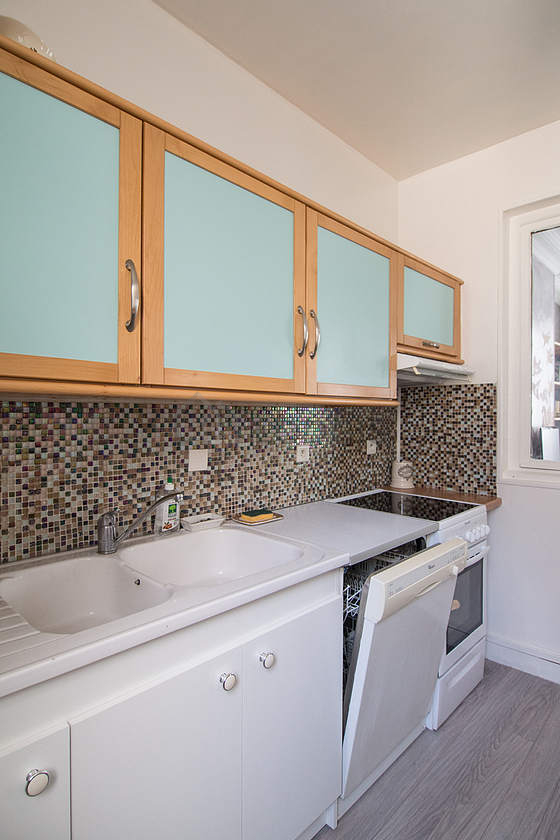 Bright kitchen with windows facing the courtyard