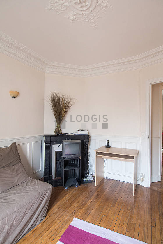 Living room with windows facing the road