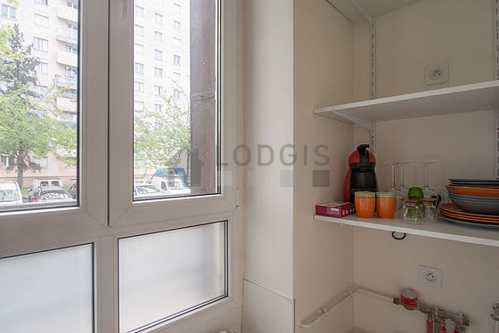 Bright kitchen with double-glazed windows facing the road
