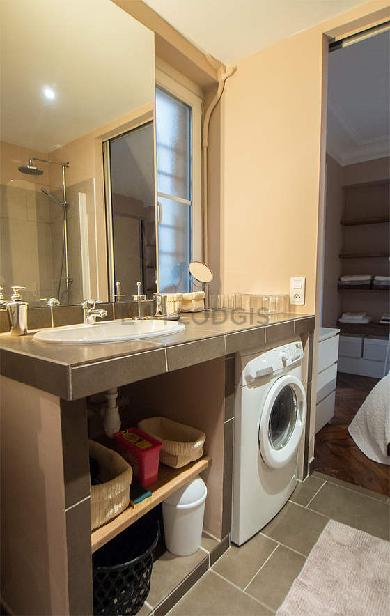 Pleasant and bright bathroom with windows and with tile floor