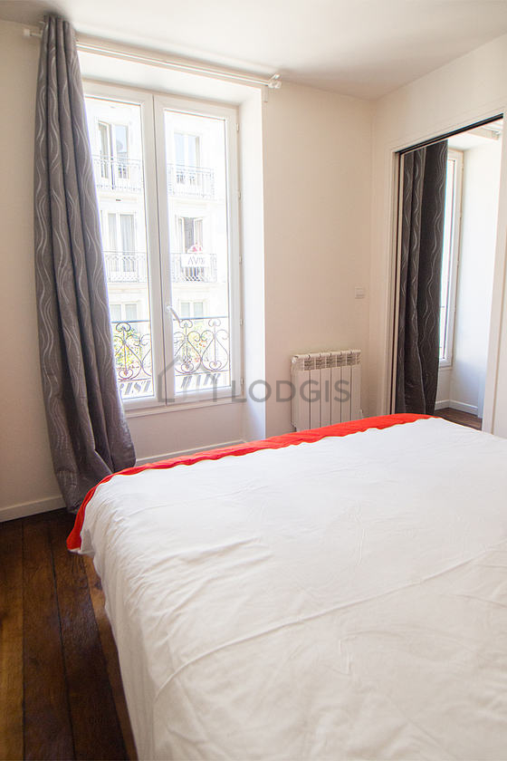 Bedroom with windows facing the road
