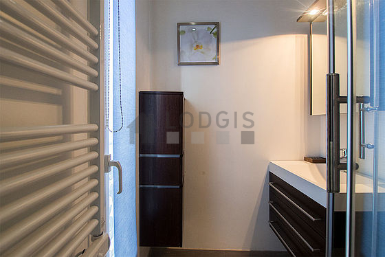 Beautiful and bright bathroom with double-glazed windows and with tile floor